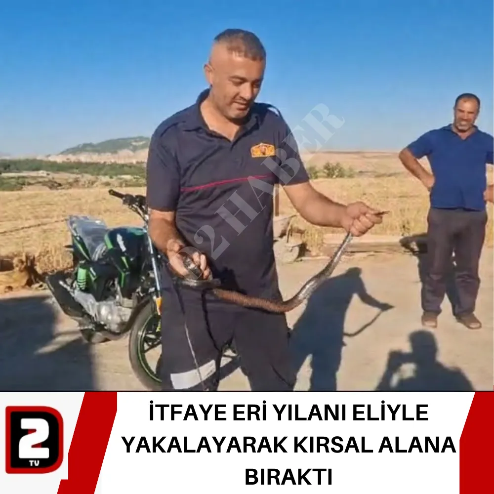 İTFAYE ERİ YILANI ELİYLE YAKALAYARAK KIRSAL ALANA BIRAKTI